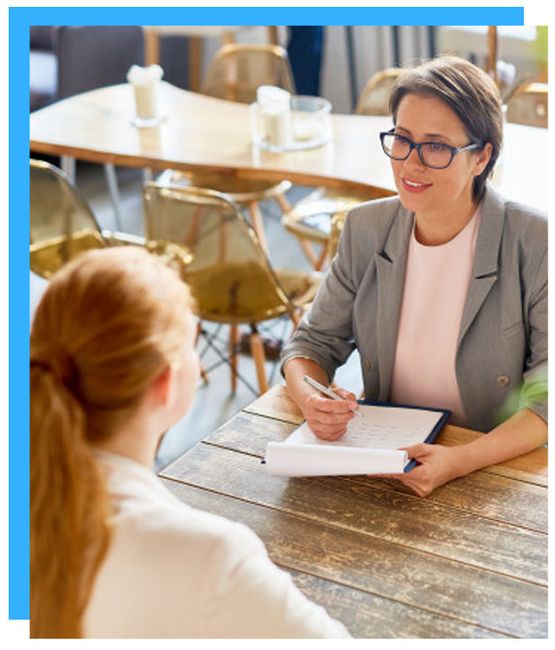 Image two corporate females having business meeting at a cafe 